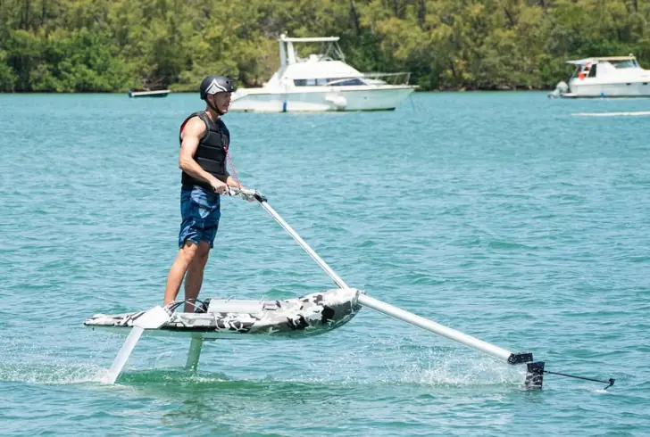 Electric hydrofoil gliding smoothly above water